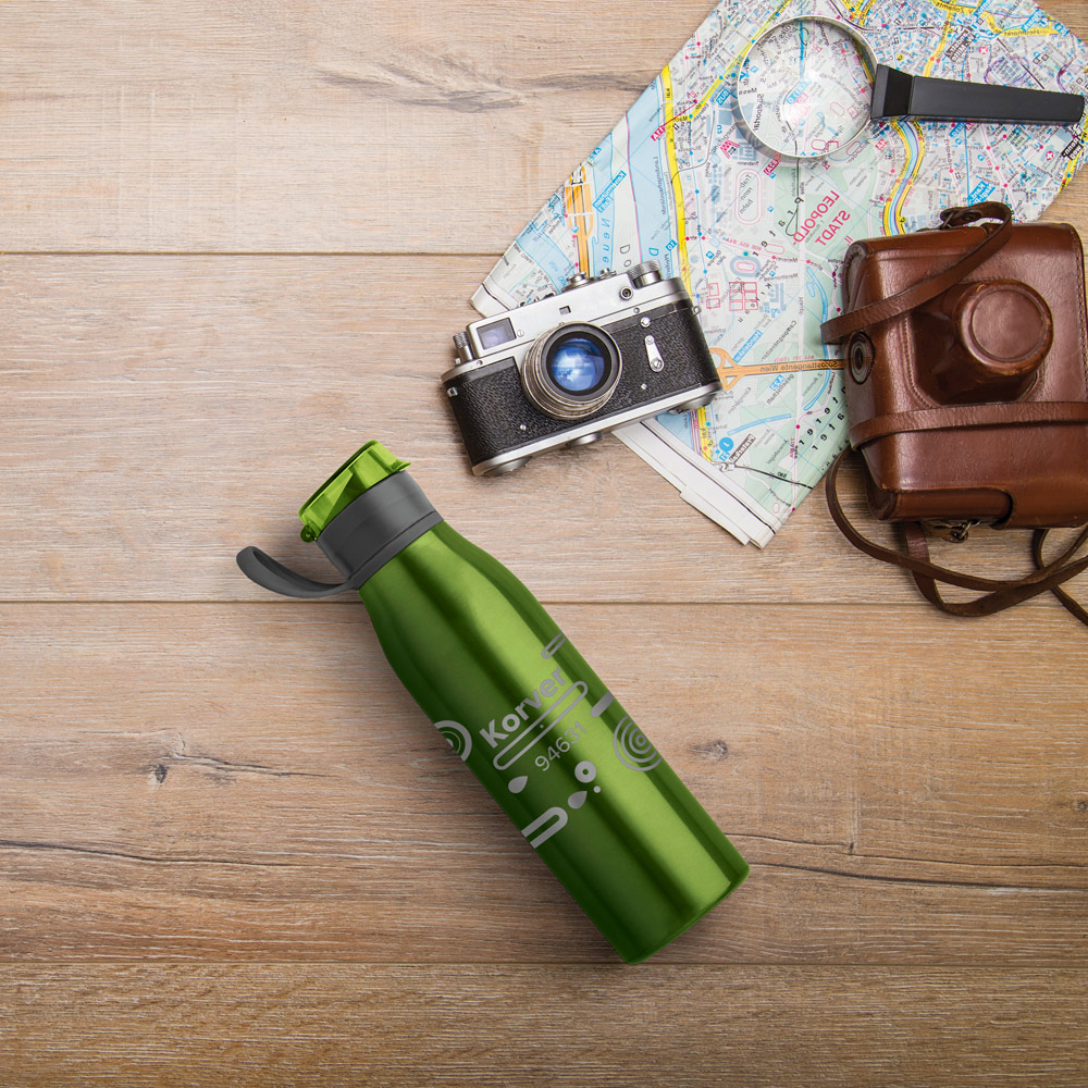 Composition on wooden desk with map of Wienna, magnifier and an old camera